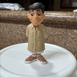 The figurine in the image is "Enrique" from the Mijos Homies Series 3 collection